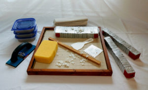 Slate tile kit: slate pieces, form and backing, tools, grout, etc.