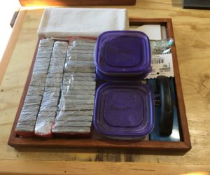 Slate tile kit, with backing, slate pieces, grout, and tools.